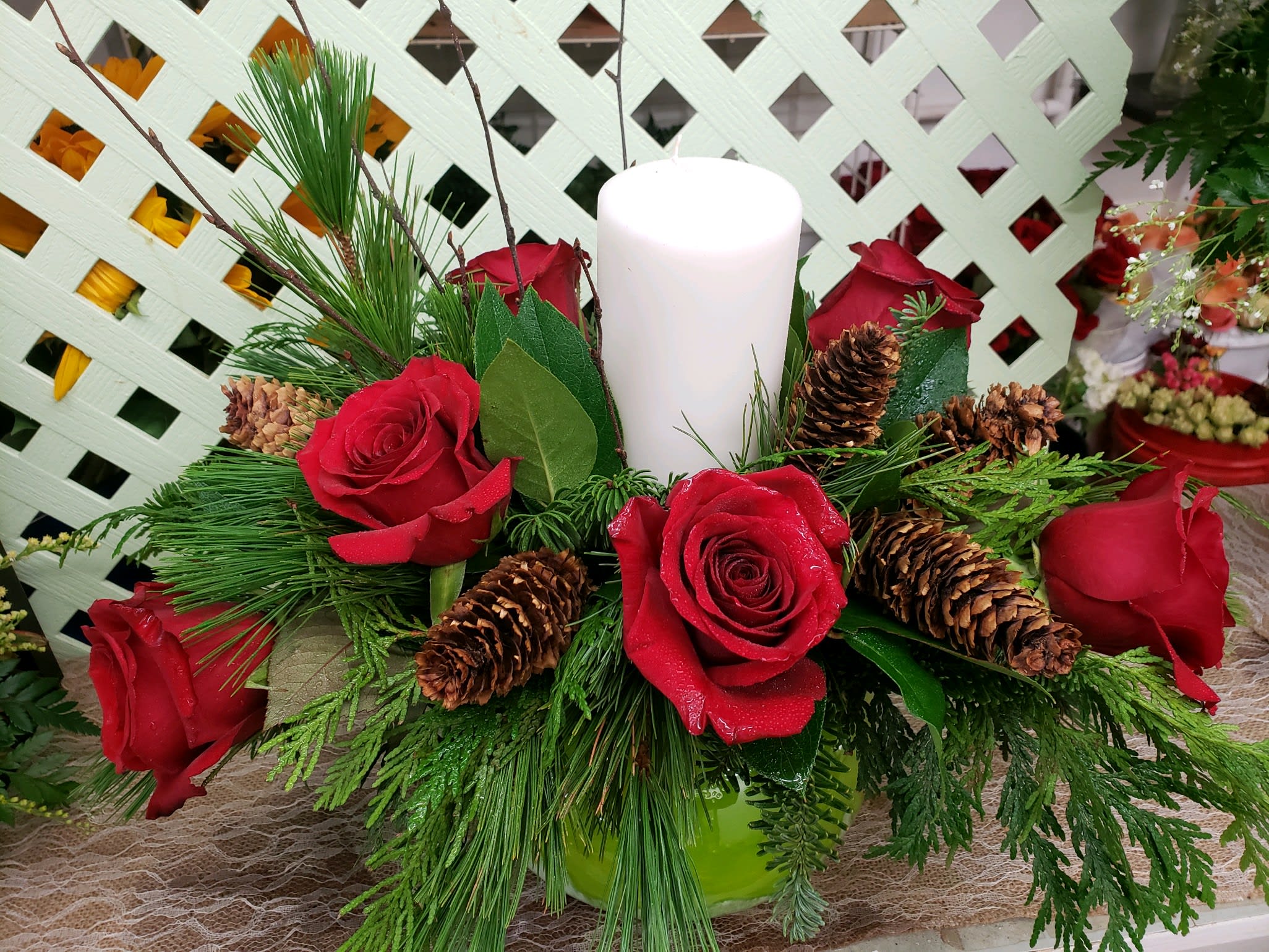 Holiday Centerpiece with Pillar Candle  - Holiday centerpiece puts the finishing touch on the dinner table or buffet. We can customize this to suit, just leave us some details in the “special instructions” box when you place your order. 