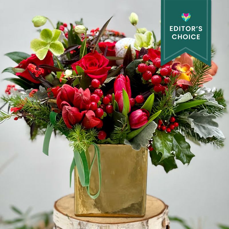 A HOLIDAY TO REMEMBER (Editor's Choice) - A gorgeous design filled with seasonal greens, Amaryllis , roses, tulips and seasonal touches… this one is one to remember this holiday season. It comes in a beautiful 6x6 gold container.