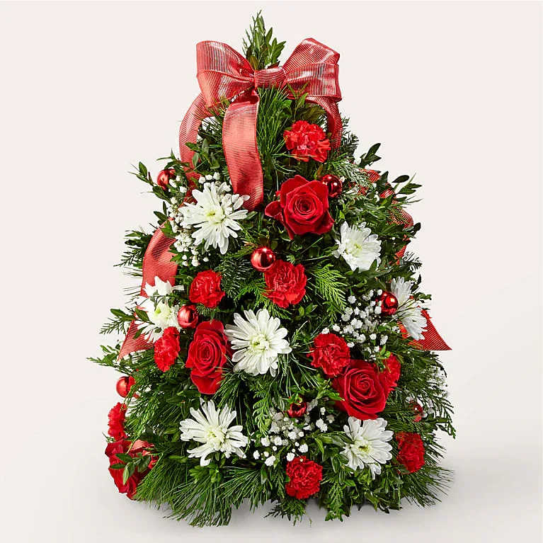 Make It Merry Tree - The mini tree of your dreams, combining the glorious scents of holiday greens with blooms like roses, poms, and mini carnations.