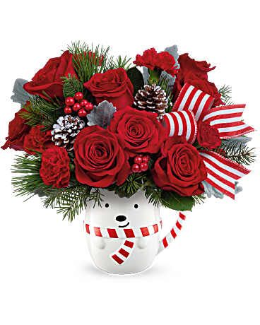 Teleflora's Send A Hug Beary Wish Bouquet - Teleflora's Holiday Collection | Local Delivery Only  Teleflora's Send A Hug® Beary Wish Bouquet is brimming with red roses, festive greens, and holiday cheer! Arranged in Teleflora's adorable bear mug, it's the perfect way to send warm wishes and smiles this Christmas. This arrangement includes red roses, red carnations, and red miniature carnations. Accented mixed seasonal greenery and designed in a keepsake Send A Hug® Cozy Cub Wish Mug