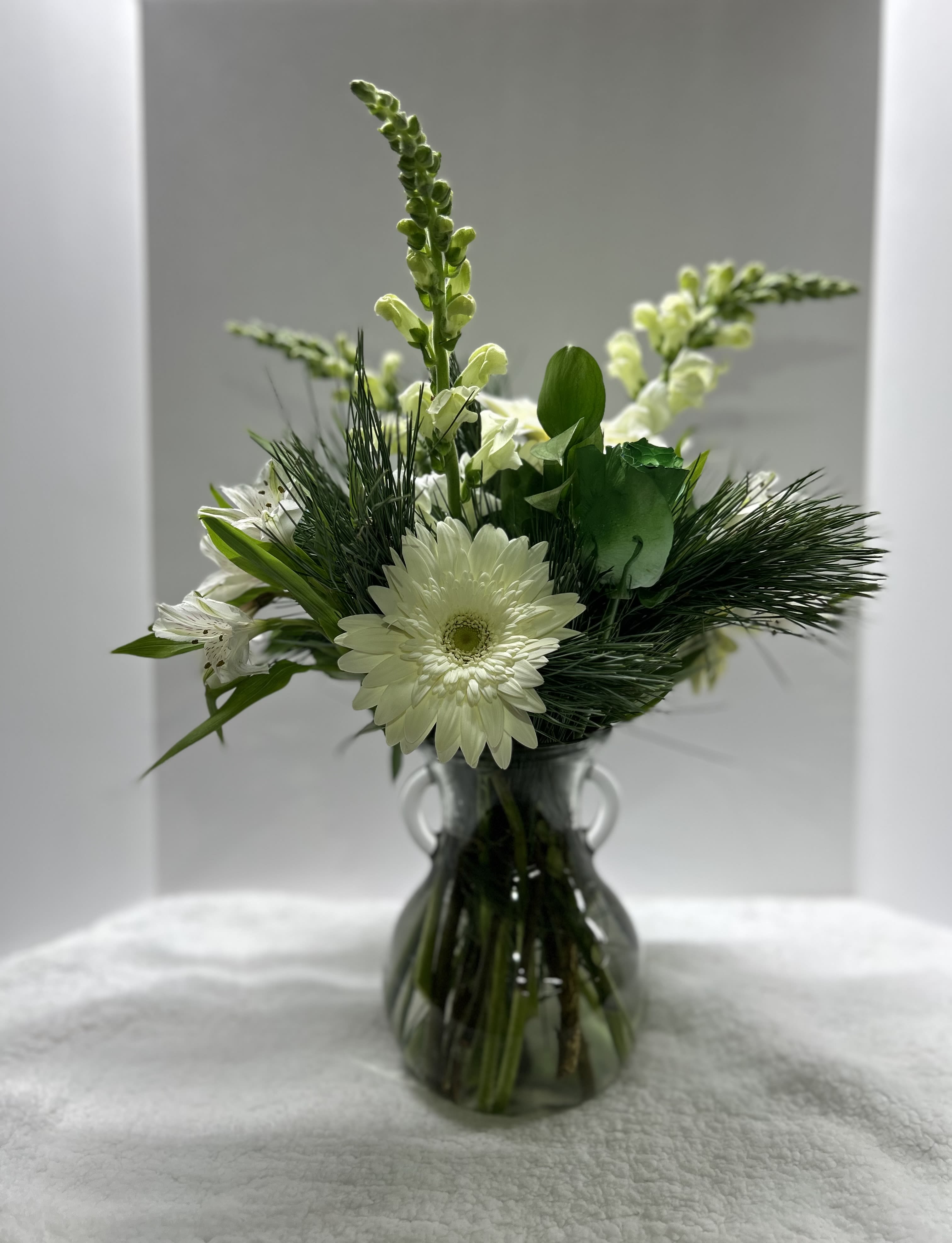 Winter Wishes - Clear vase filled with mixed pine and fresh flowers 