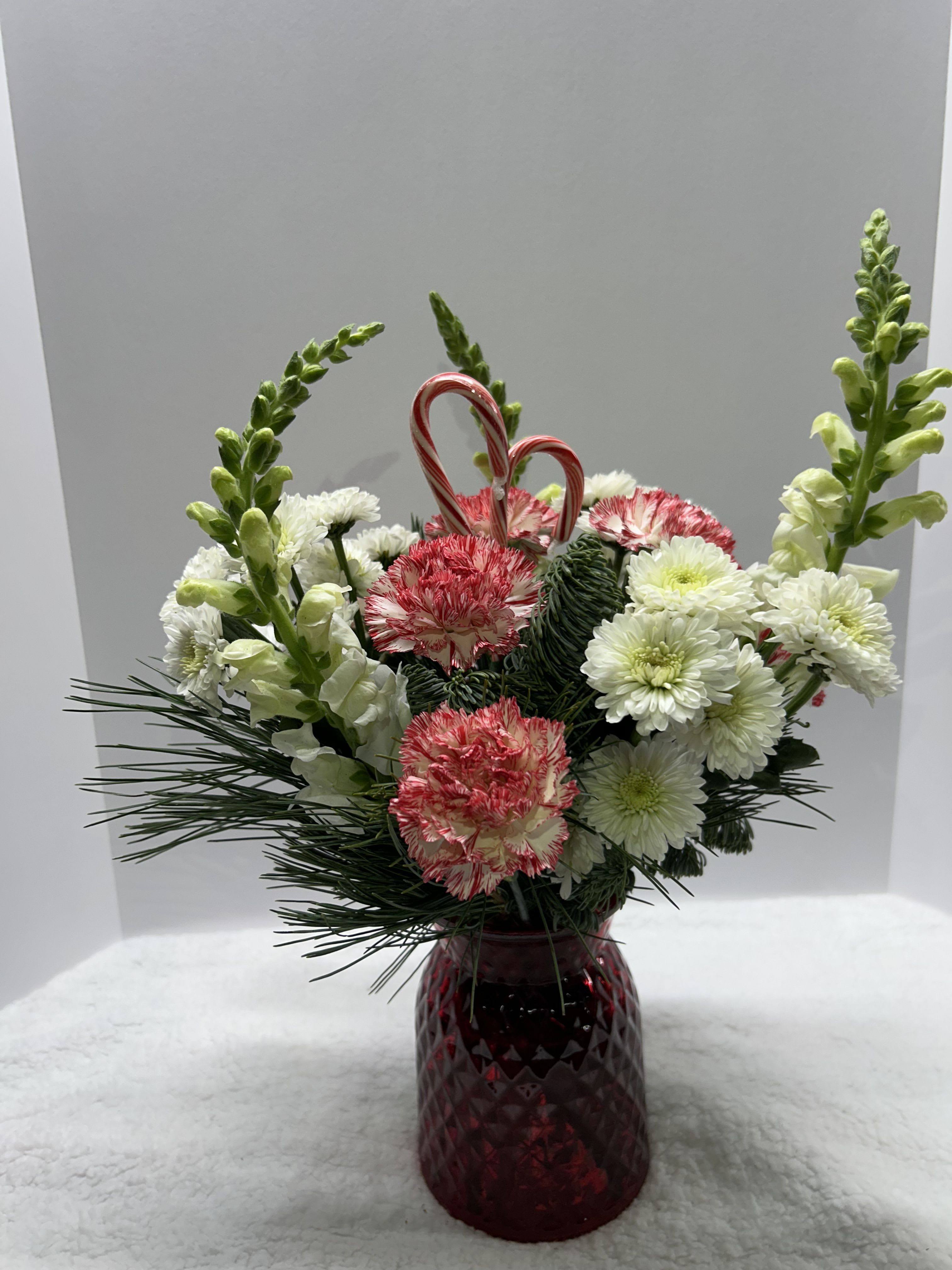 Peppermint Kisses - Red vase filled with mixed pine and flowers 