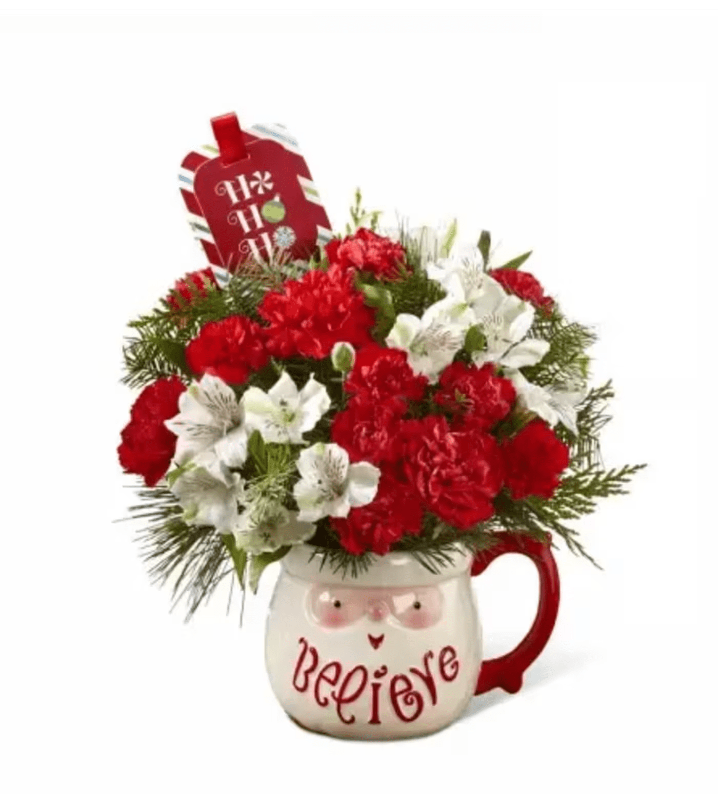  Hallmark Believe Mug for Christmas - Sweet and stylish, this holiday flower arrangement exudes the fresh and fun Hallmark look you have come to know and love for years! Fanciful and oh, so festive, we bring together red roses, carnations, and mini carnations mingling with snowy white Peruvian lilies and an assortment of Christmas greens, arranged to perfection in a keepsake ceramic Santa mug with the word, "Believe" at the bottom in a lively font. Presented with an exclusive Hallmark tag that reads"Ho, Ho, Ho" this unique holiday bouquet is ready to create an unforgettable Christmas treasure for your special recipient.