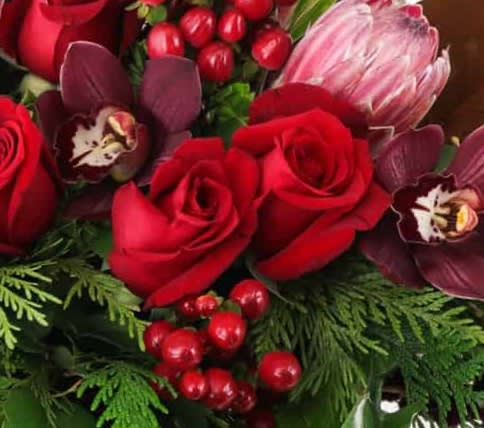 Designer's Choice Holiday - lush, colorful, modern holiday arrangement designed with a combination of premium flowers 