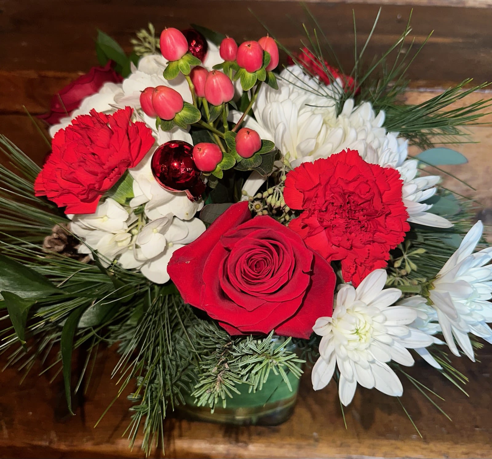  Christmas Blessings Bouquet - Red roses, carnations, hypericum berries, white hydrangea, chrysanthemums, balsam and pine and ornament in a glass cube