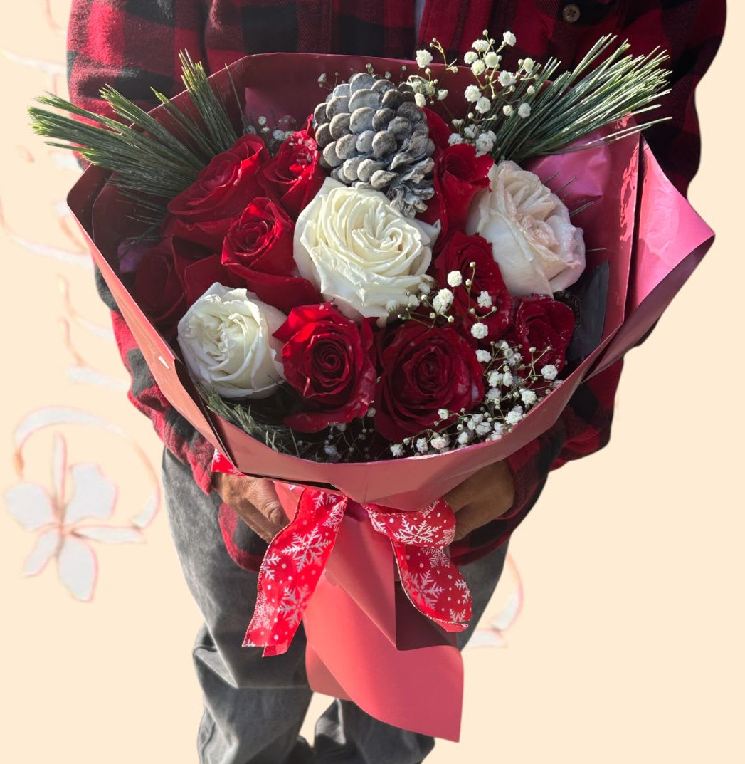 Winter Love Pine Cones &amp; Red White Roses Hand Wrapped  Bouquet  - The winter love rose  pine bouquet brings the beauty of the season to life with a winter blend of red roses, 3 white garden roses , holiday greens,  and rustic pine cones. Wrapped in gift wrap paper and dressed with ribbon. This elegant bouquet, with its rich holiday colors and natural pine elements, creates a stunning display that’s perfect for celebrating any occasion, Christmas or sending warm winter wishes. 