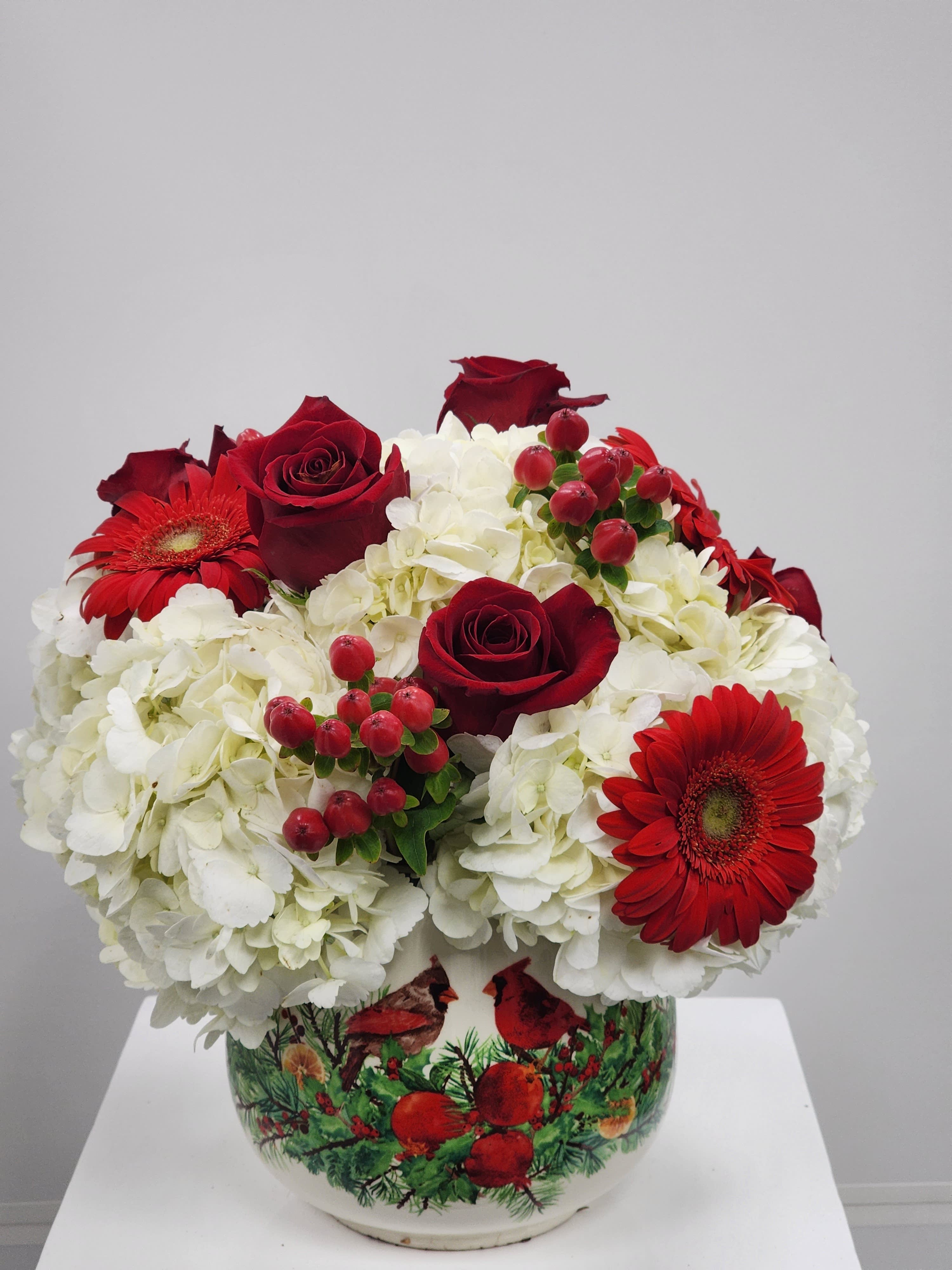 Cardinal Love - Select this lovely white and red arrangement with a ceramic cardinal designed vase. Filled with roses, gerbera daisies, hypericum, and based with hydrangea.  Approximately 13&quot; tall by 12&quot; wide.