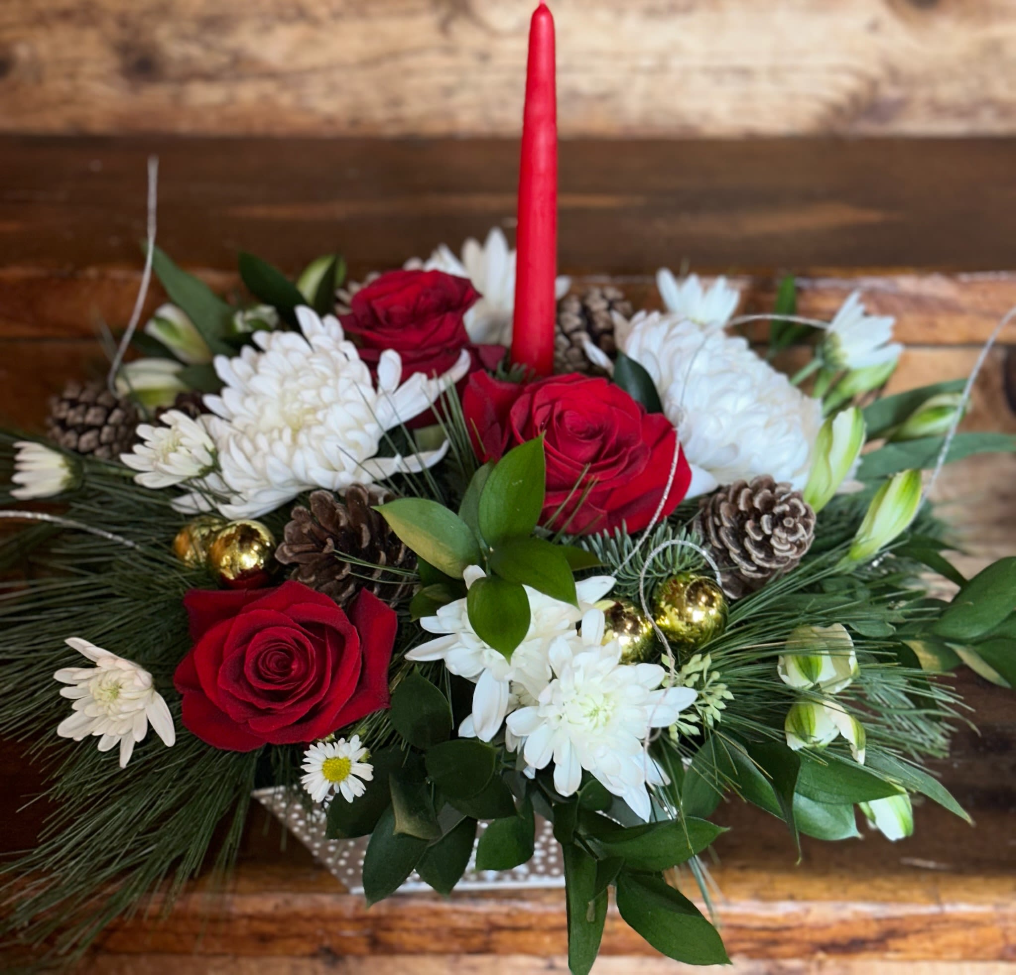 Imperial Holiday Grande Glow Centerpiece - Red roses, white alstroemeria, white chrysanthemums, ornaments, ting ting, pinecones, balsam, pine in a Christmas keepsake container