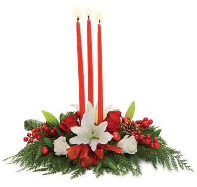 Trinity Candle Centerpiece - A trio of red taper candles hover above the perfect holiday centerpiece of white lilies, red roses, holiday trim, berries and pine boughs.
