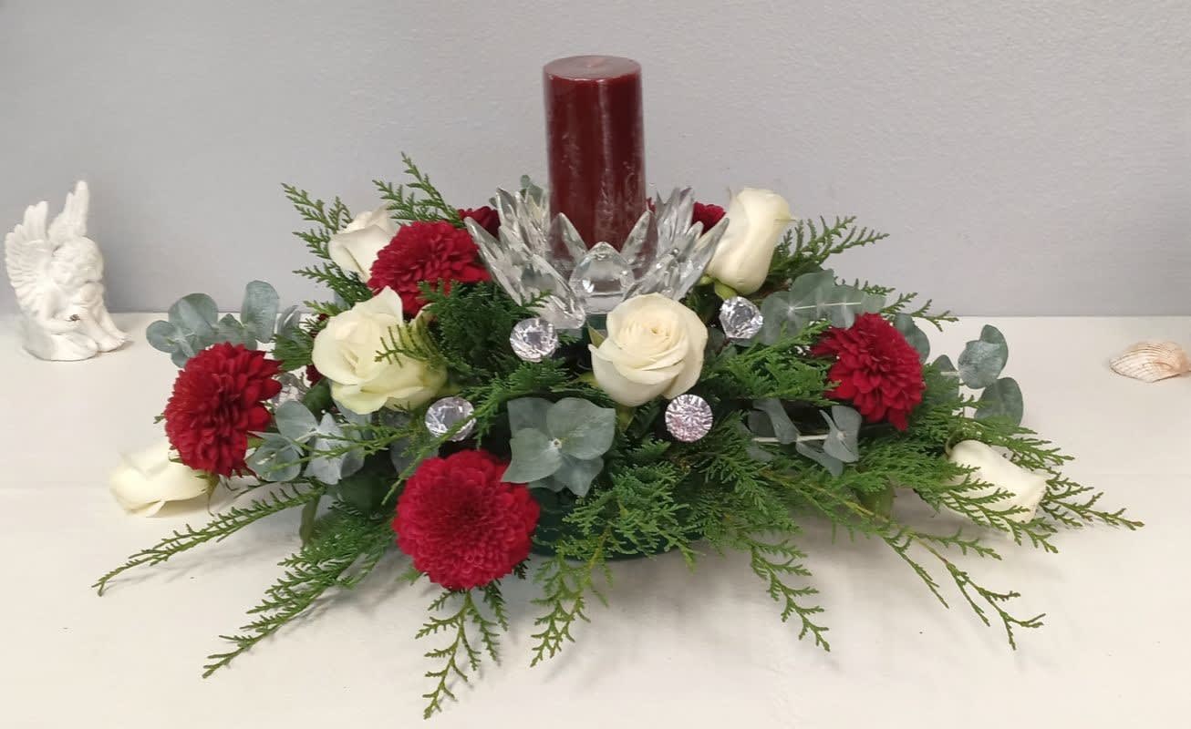 The Holiday Crystal Centerpiece - This gorgeous crystal-loaded centerpiece features red and white roses, eucalyptus with other flowers, and holiday greens to adorn any holiday setting. 