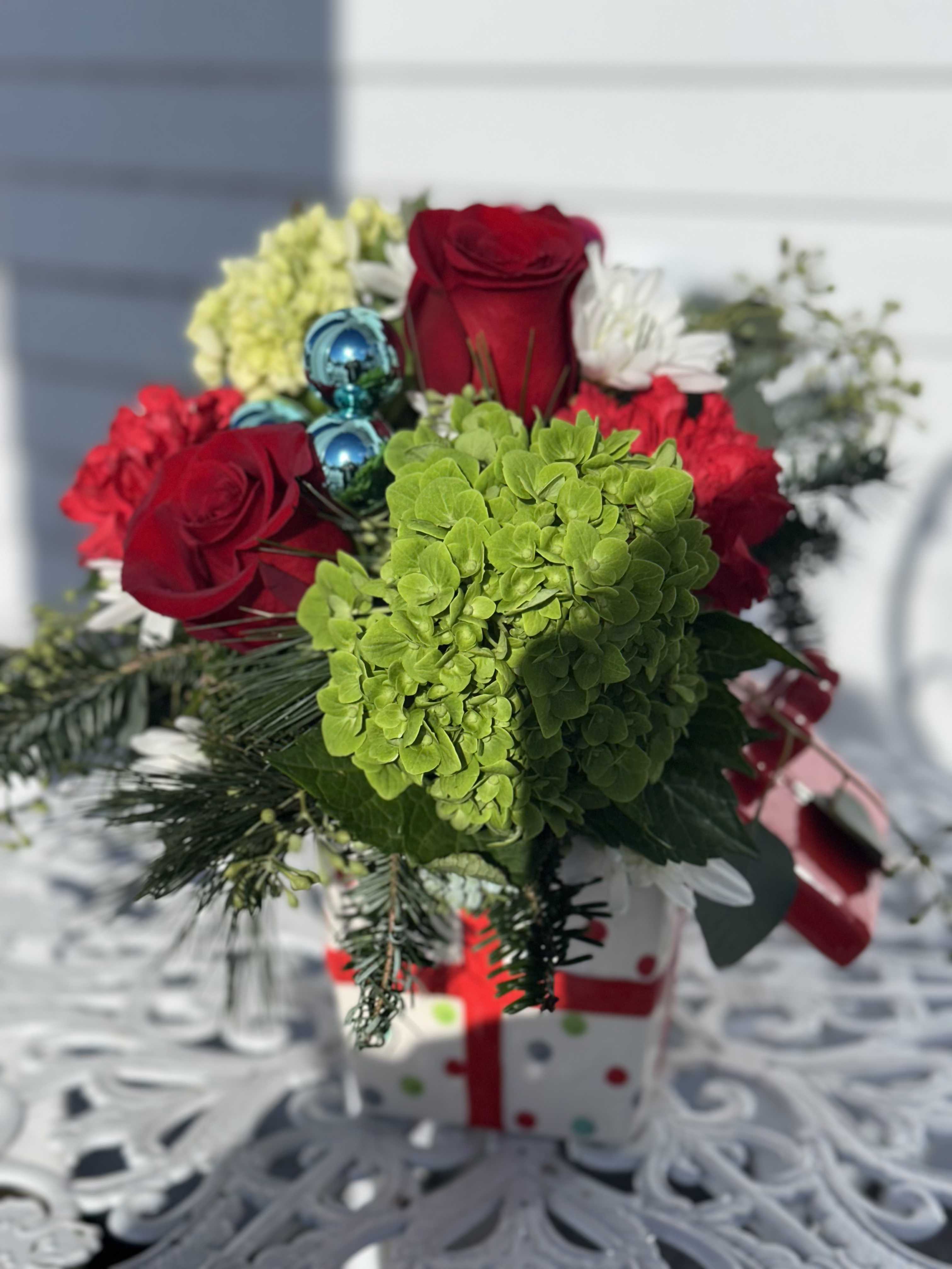 Jolly Present  - Ceramic present filled with red roses, carnations, green hydrangeas and white  chrysanthemums 