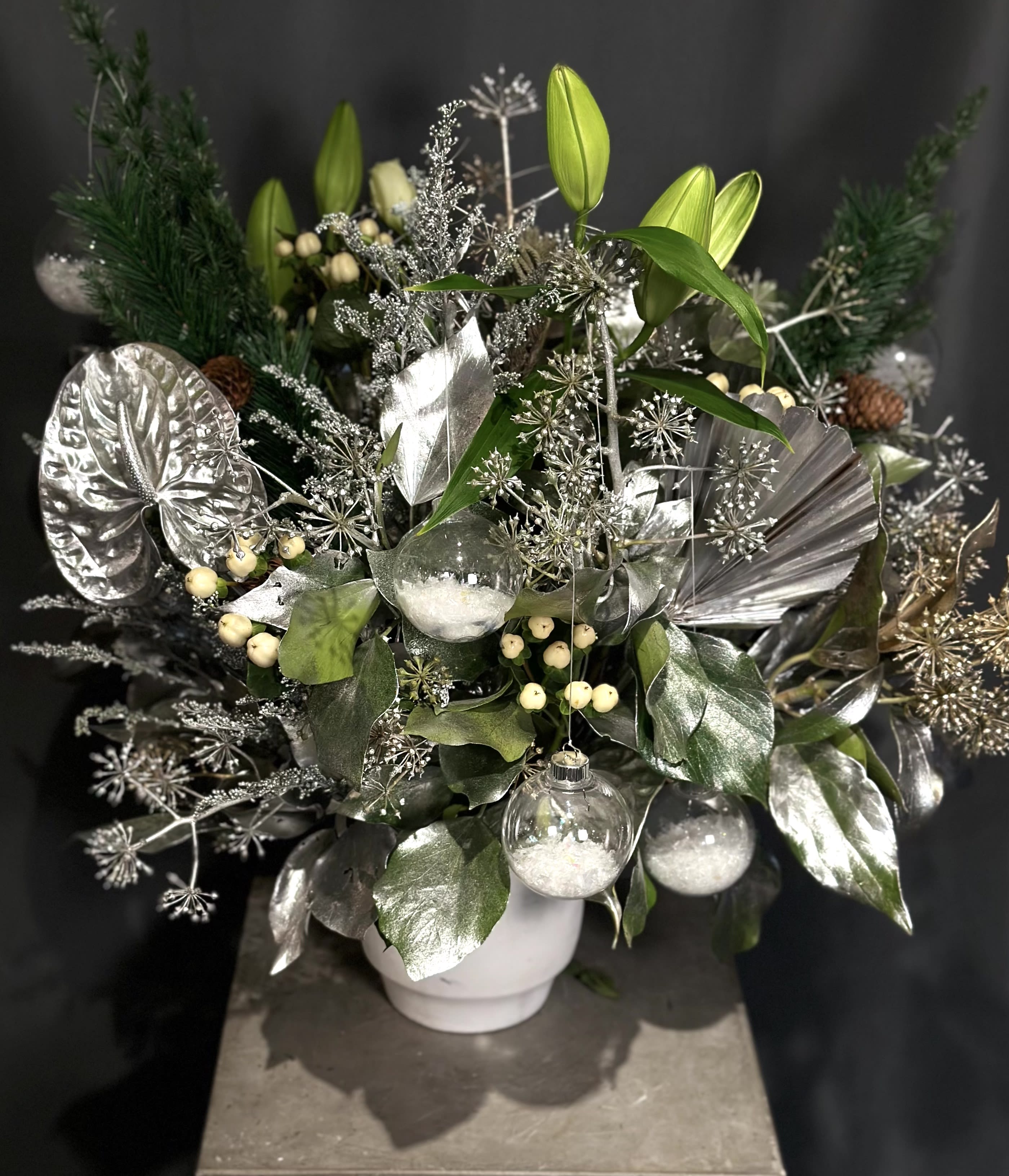 Frosted Winter - This luxurious arrangement instantly transports you to a chic chalet in the Swiss Alps. This seasonal design will transform any gathering into the event of the season.