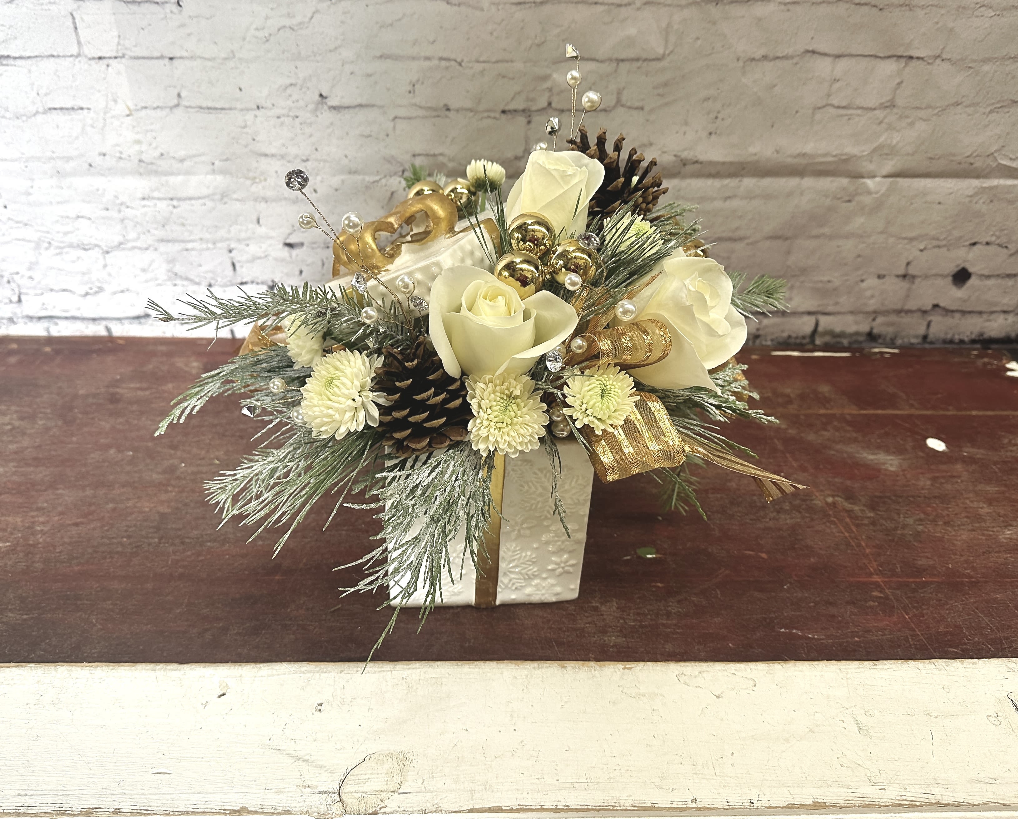 Gold and glam  - Gold present container filled with white Christmas florals and a little *extra* gold sparkle