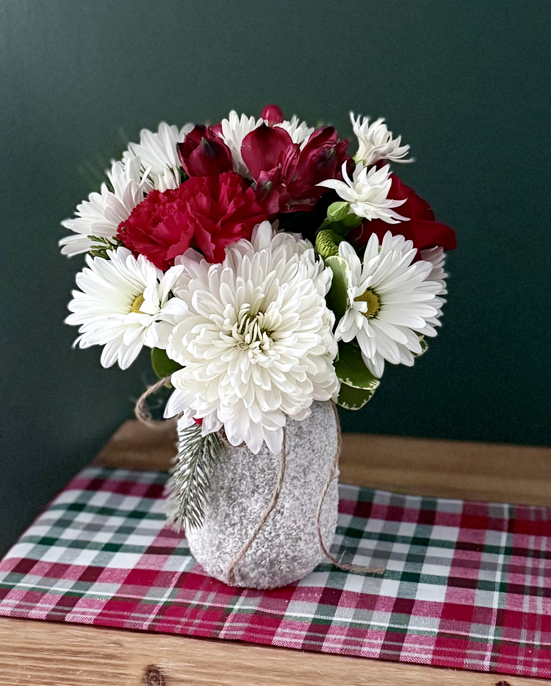 Frosty  - A cute pint size jar with a white “frosted” texture, filled with a cremon, daisies, red alstroemeria and a red rose for a pretty Christmas/winter look! The perfect size for setting anywhere in the home or office. 