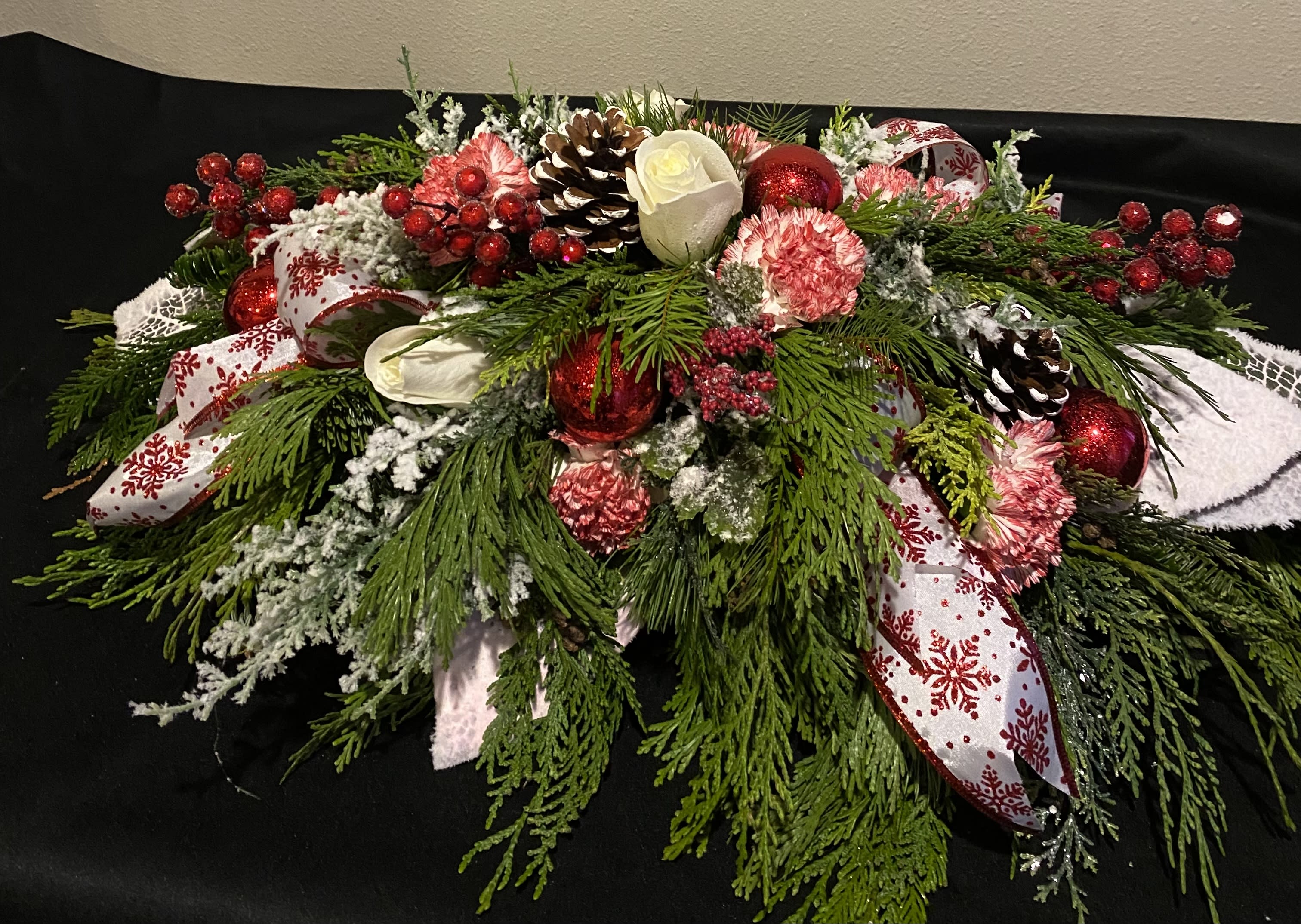 Frosted Traditions Centerpiece - This Centerpiece is frosted with some white flocked pieces to give the feeling of snow. The colors of red and white will surely warm the hearts of family or friends for the holiday season. Ribbons, bling and flowers may vary.