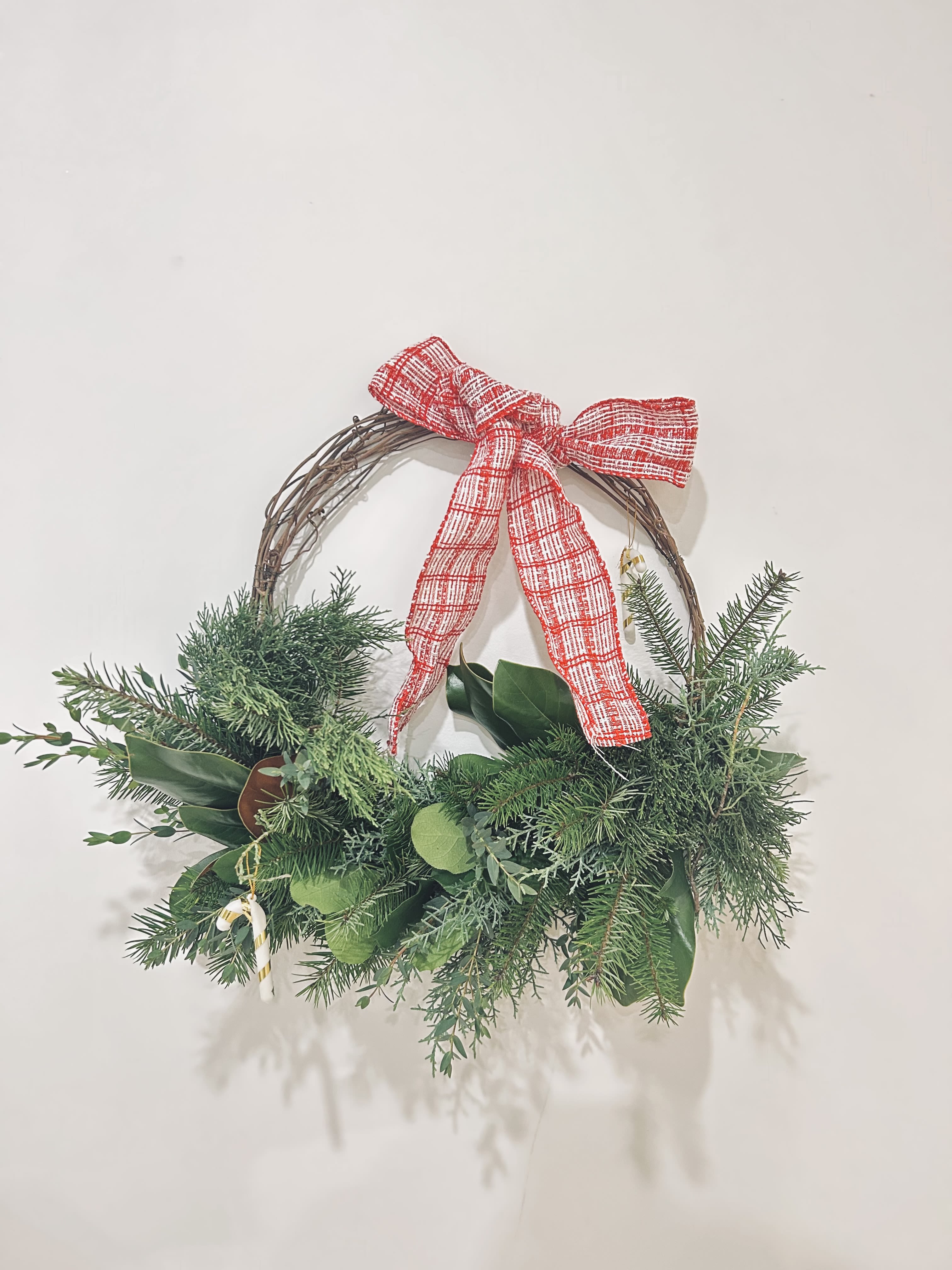 Sweet Cane wreath  - Wreath is available in one size. Decorated with Christmas greenery, ribbons, &amp; Christmas ornaments! Perfect for this season and for your door! 