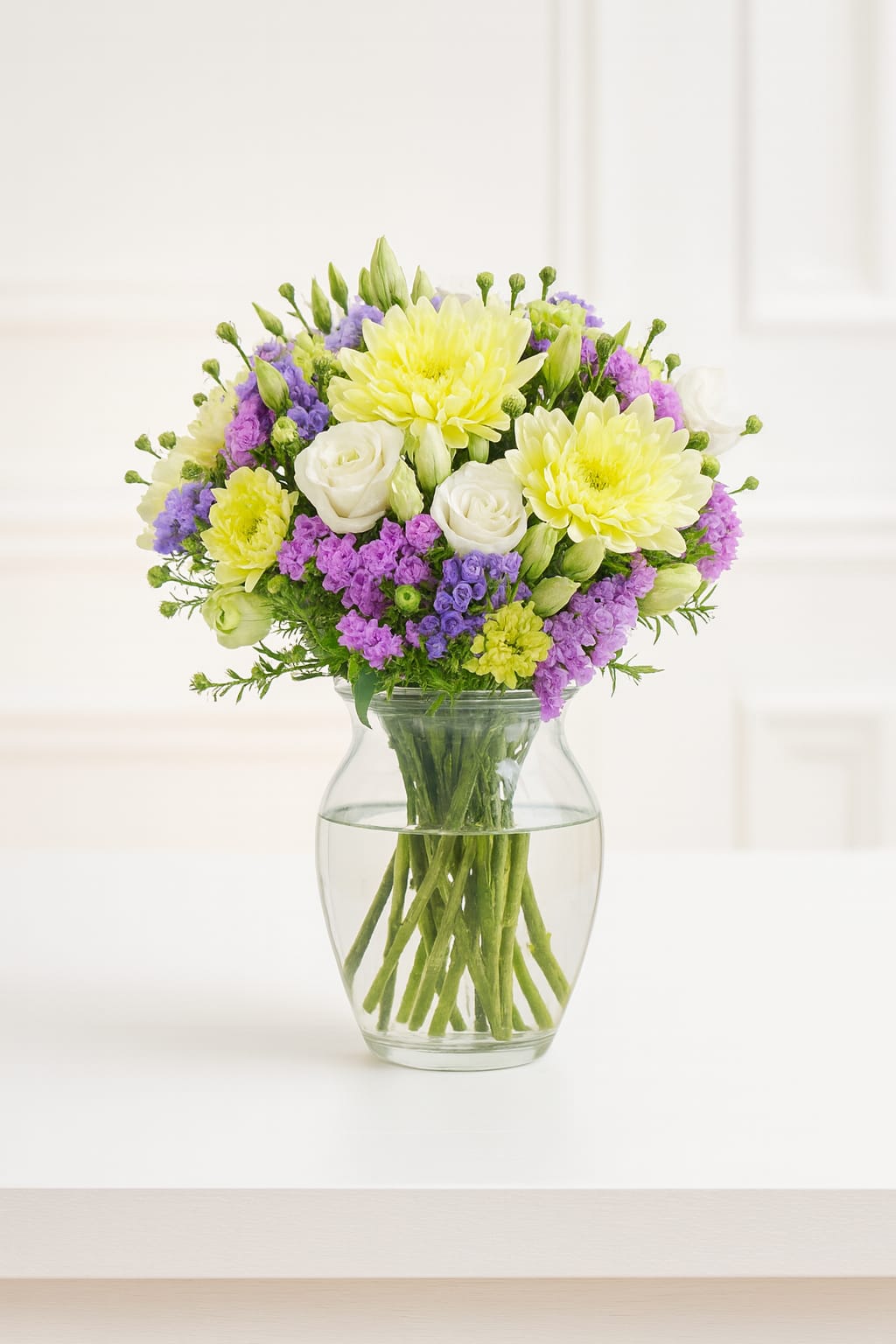 Melange de Fleurs - Melange de Fluer a beautiful mix of fresh seasonal flowers, includes roses, mums, purple stock accents and daisies. 