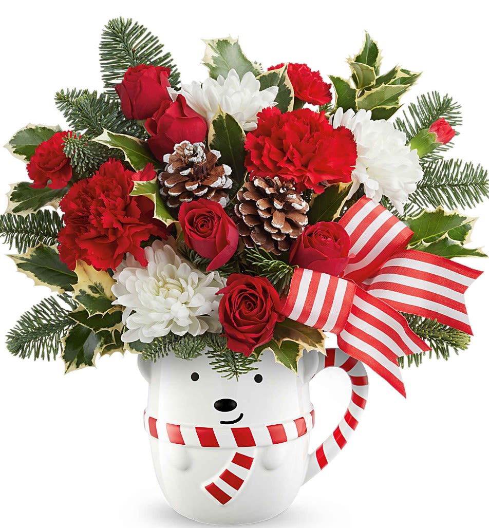 Teleflora's Send a Hug Cozy Cub Wish Bouquet - Send warm holiday hugs with Teleflora's Send a Hug® Cozy Cub Wish Bouquet! Festive red blooms and fresh greens arrive in Teleflora's adorable bear mug-perfect for Christmas cheer and cozy winter gifting.