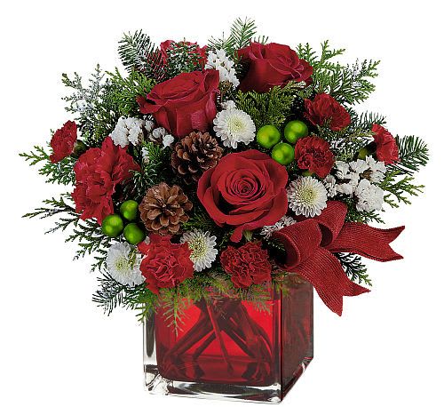 Holly Jolly&quot; arrangement - Celebrate the season with the vibrant &quot;Holly Jolly&quot; arrangement! Bursting with festive red carnations, delicate white blossoms, and lush evergreen sprigs, this design is accented with frosted pinecones and bright green ornaments for a playful touch.