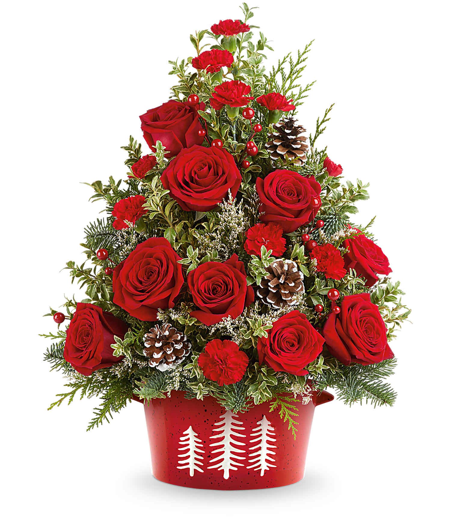 Teleflora's Holiday Traditions Tree - Bring holiday cheer home with Teleflora's Holiday Traditions Tree. This festive floral tree of red roses, holiday greens, and pinecones is hand-arranged in Teleflora's food-safe Snowy Pines Dish -perfect for tabletops or holiday gifting. Approximately 17&quot; H x 14&quot; W