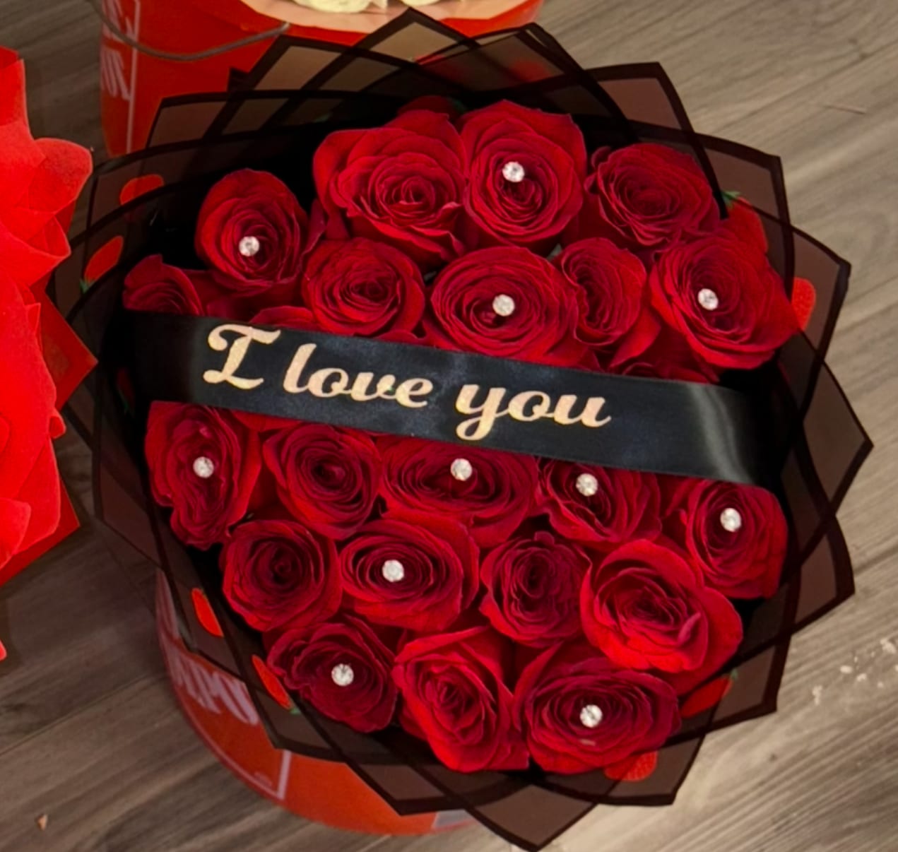 Red Classic - Our everyday bouquet , great for any occasion  25 Count red roses wrapped in black paper , topped with a I love you ribbon 
