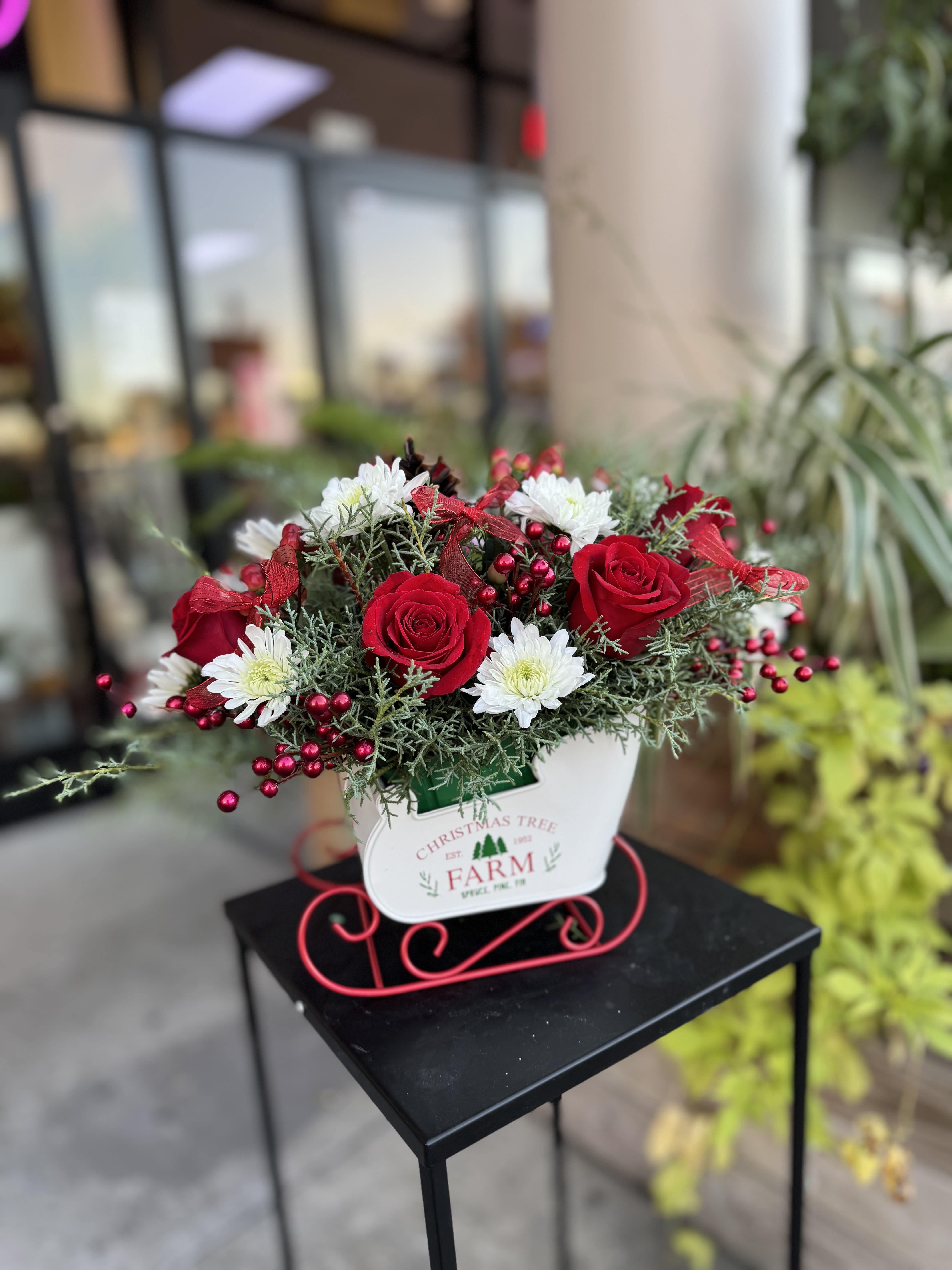 Winter Blooms #3 - Winter flower arrangements capture the season’s charm with frosty whites, deep reds, and lush evergreens, accented by pinecones, berries, and subtle silver or gold touches. Perfect for bringing warmth and elegance to any space, they evoke the serene beauty of snowy landscapes and holiday cheer.