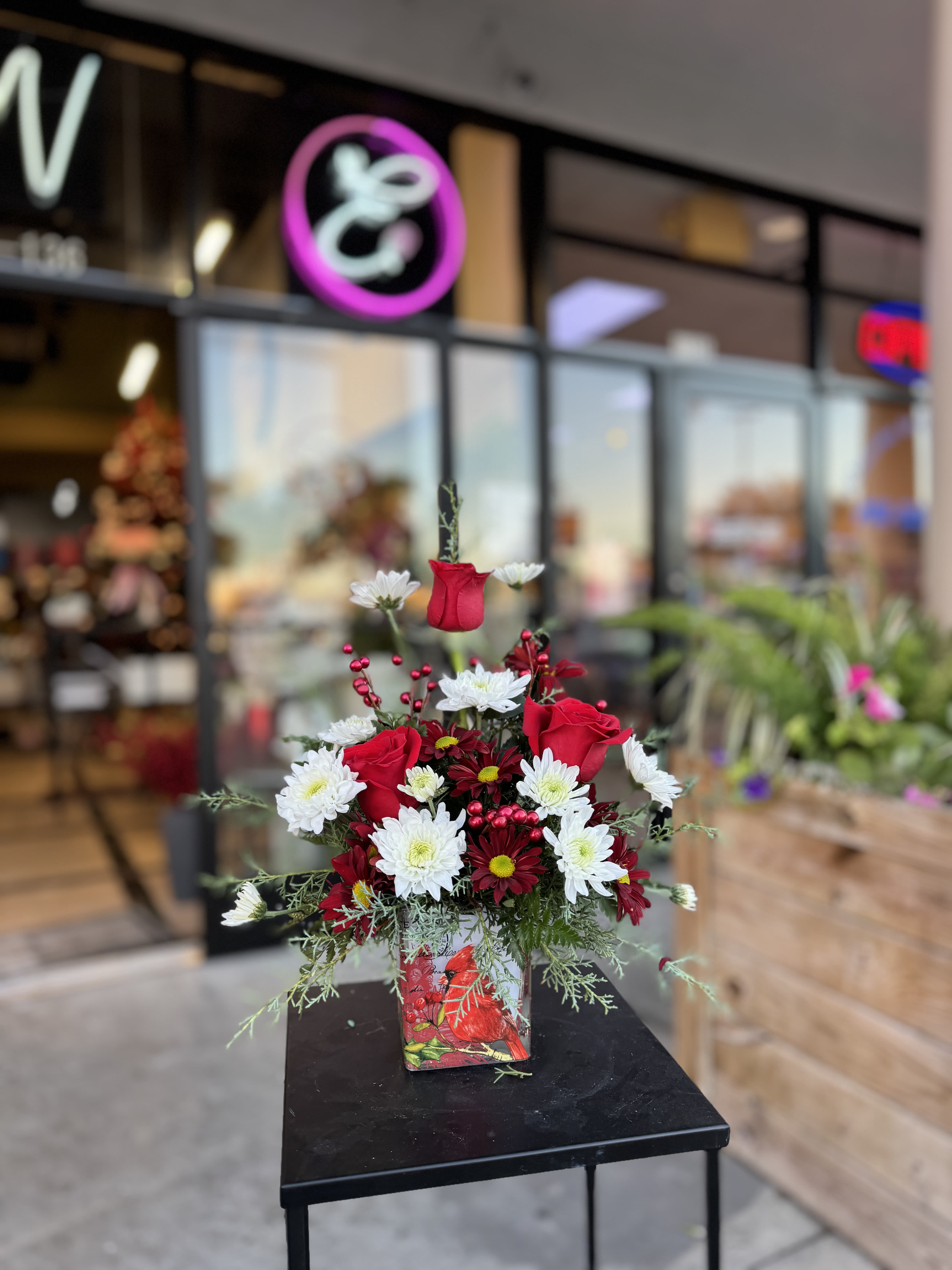 Winter Blooms #4 - Winter flower arrangements capture the season’s charm with frosty whites, deep reds, and lush evergreens, accented by pinecones, berries, and subtle silver or gold touches. Perfect for bringing warmth and elegance to any space, they evoke the serene beauty of snowy landscapes and holiday cheer.