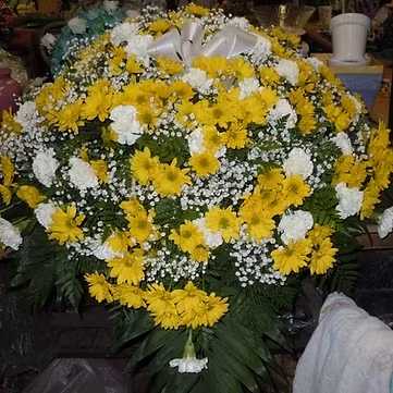 C3 Casket Spray - Casket spray - mix of yellow diaises and white carnations, baby's breath, and greens.  Banner- $15.00 + extra  Substitutions may apply, pending flower availability.