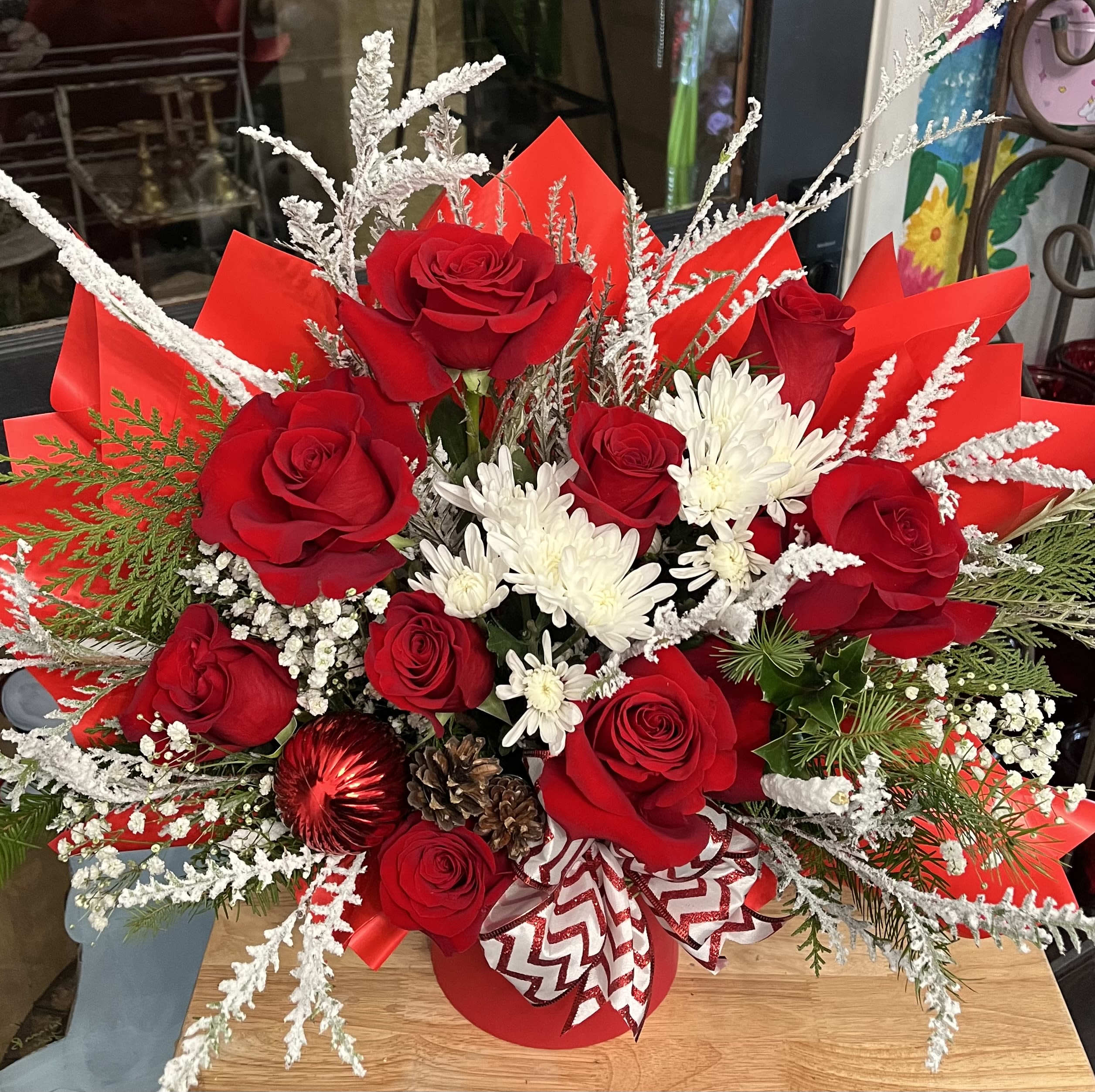 A Beautiful Christmas  - A beautiful Christmas arrangement in a boutique box, perfect gift for anyone.Beautifully made with Roses, chrysanthemums,mixed Christmas greenery, festive decor, and beautiful bow