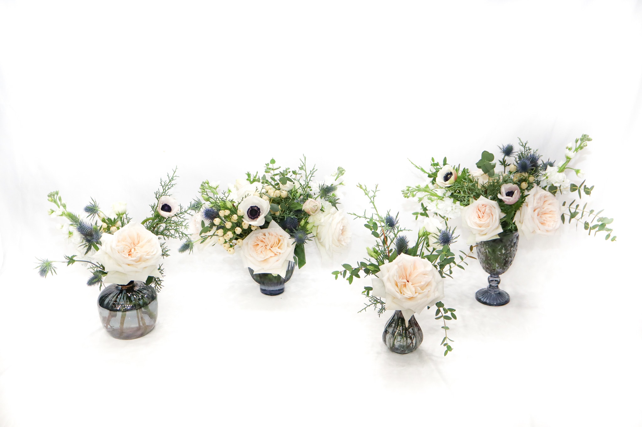 Cold Snap - Cold Snap is one of our newest arrangements from our Holiday collection, a beautiful set perfect for festive and unforgivable table. Comes in blue glass vases.