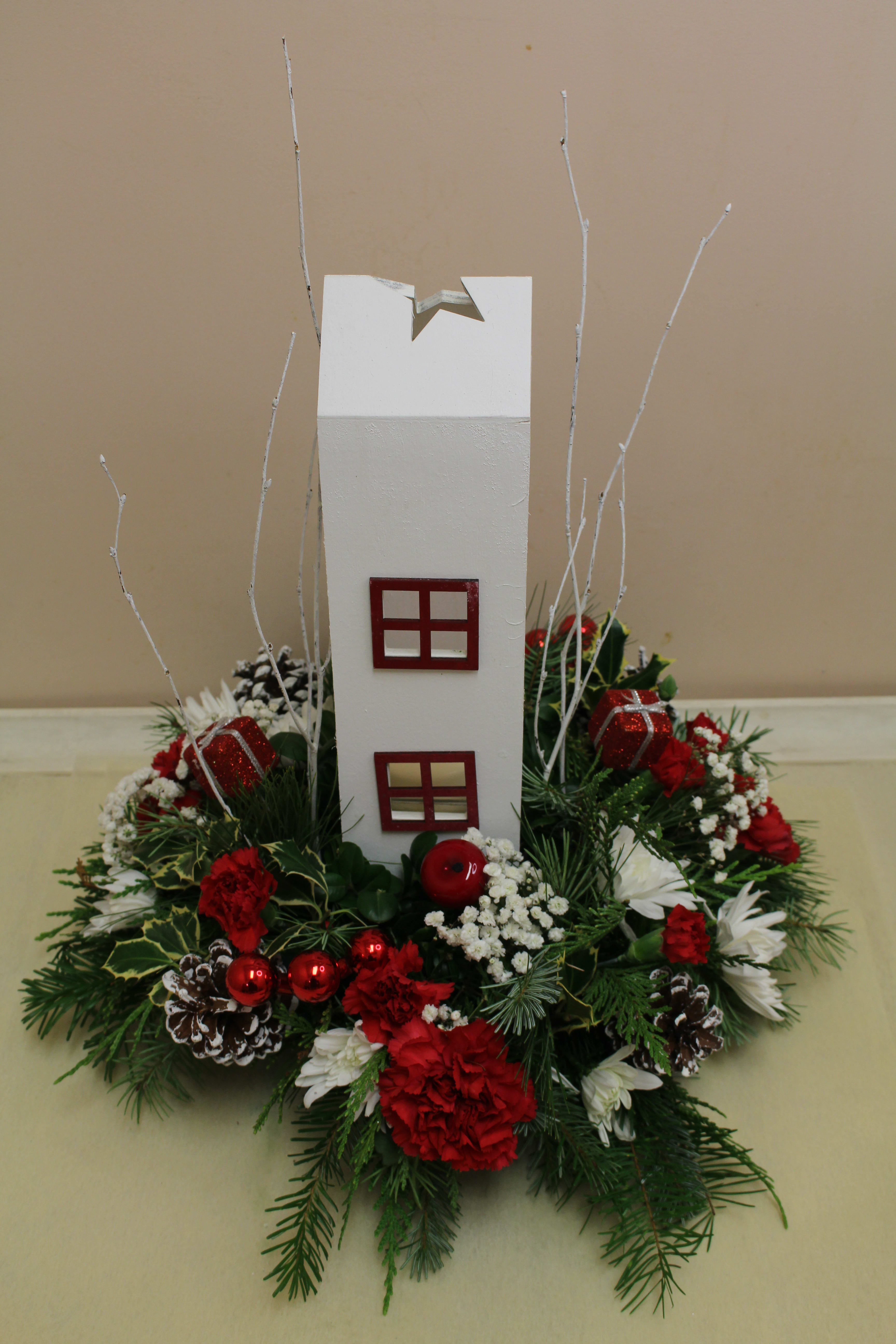 home for the holiday's candle centerpiece - sweet keepsake centerpiece of a tall home candle piece.  filled with a Christmas arrangement 