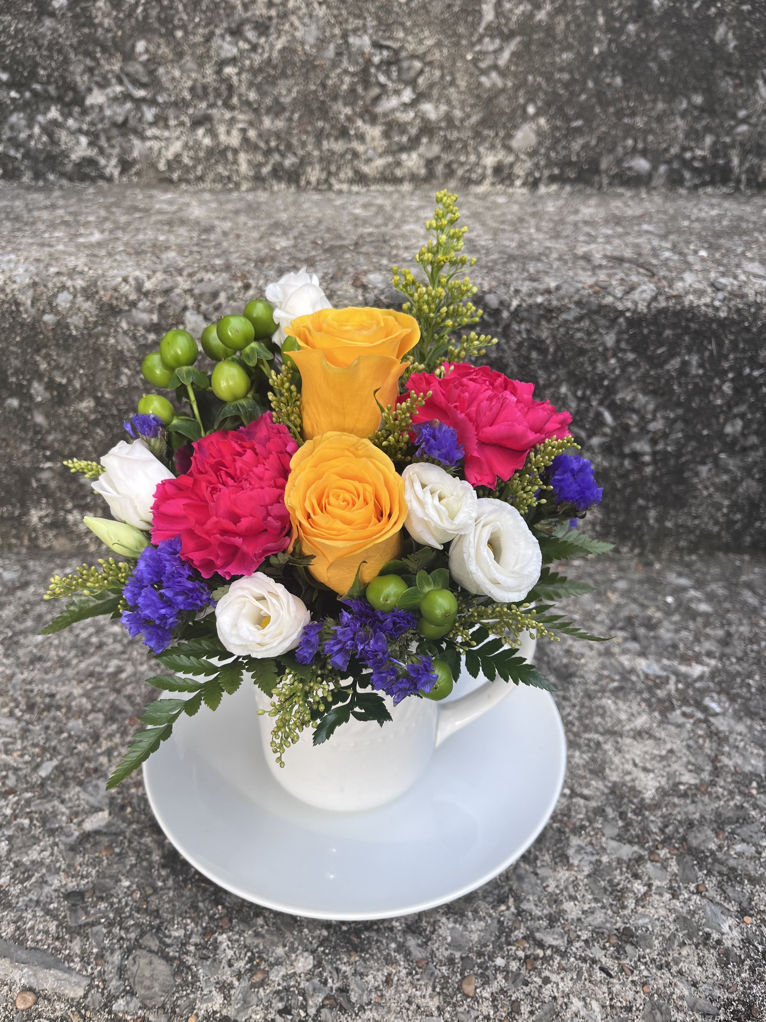 Garden Coffee - This arrangement has roses, carnations, hypericum, statice, solidago, lisianthus, and greenery.