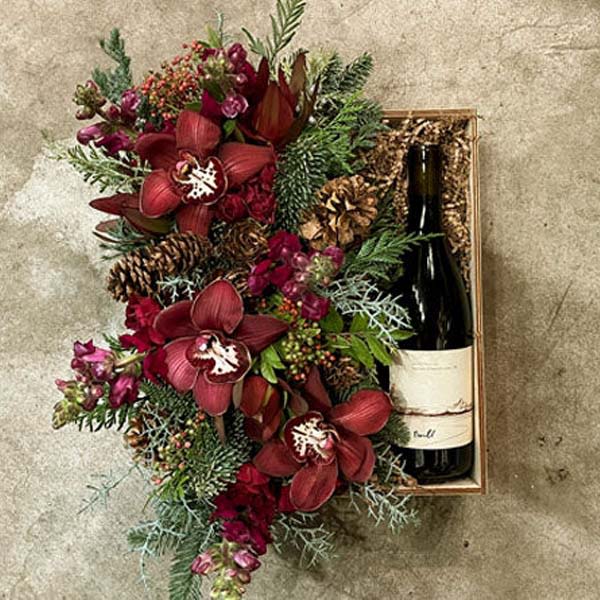 Holiday Cheer - This pairing brings together the festive colors&nbsp;of the season with a rich holiday vibe.  We have&nbsp;paired a&nbsp;2013 Willamette Valley Pinot Noir from Twill Cellars&nbsp;with an arrangement of&nbsp;lush&nbsp;seasonal blooms and foliage which comes in our signature reusable custom made box.  This makes a great Holiday gift!  For an added spark, add a candle or our locally crafted chocolates.&nbsp;  PLEASE NOTE: Flower varieties and colors may very due to availability but the arrangement will maintain the overall look and feel.