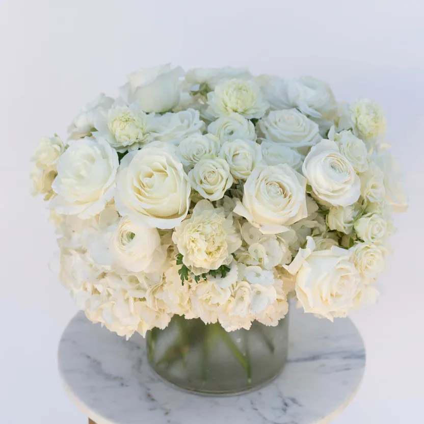Shorline - ** Premium Arrangement Shown in Photo  A timeless Studio C Florals signature arrangement featuring soft white blooms, neutral tones, and fresh greenery. Designed in our airy, coastal-inspired style, this arrangement is perfect for birthdays, sympathy, celebrations, and everyday gifting.  Expect a beautiful mix of fresh roses, hydrangea, textural accents, and premium seasonal stems — arranged in our signature clean and elegant palette.  We design each piece in-house with high-end florals and long-lasting blooms for a refined, modern look.  Available for delivery throughout Newport Beach, Costa Mesa, and surrounding areas.