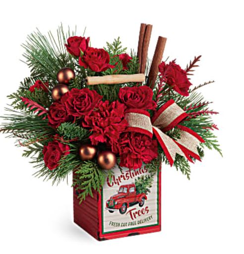 Merry Vintage Christmas - Celebrate the timeless magic of Christmas with this vintage-inspired metal cube, bursting with charming holiday blooms! This merry arrangement includes red spray roses, red carnations, grevillea, flat cedar, noble fir, and white pine. Delivered in Teleflora's Merry Vintage Christmas Cube. Orientation: All-Around