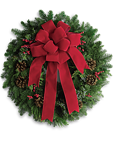 Classic Wreath - It's not Christmas without a fresh Christmas wreath on your door! Send the spirit of the season to someone special with this classic piece of holiday decor. The 18-inch wreath is composed of fragrant noble fir with touches of juniper and red berries, and is hand delivered by a local florist to ensure maximum freshness. •This 18-inch noble fir wreath is accented with juniper, red berries and pinecones and finished with a full red velvet bow. •Orientation: N/A 