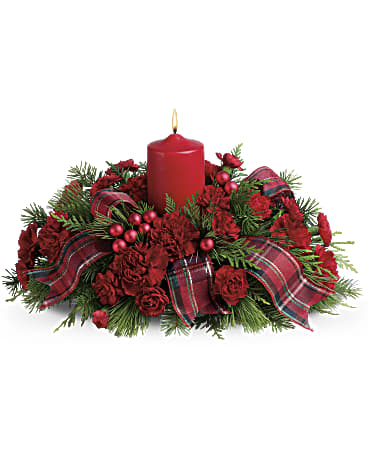 Family Celebration by Teleflora - Don't show up to Christmas dinner empty handed! Charm your hostess, family and friends with this casual Christmas dinner centerpiece that's holiday flowers, a candle and a gift all in one.