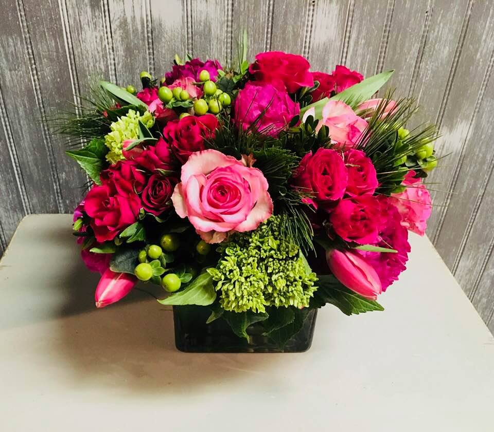 Pixie Winter - Large vase arrangement of pinks and greens, with peonies, roses, spray roses, tulips, berries , hydrangea and pine.  A beautiful statement gift for that special someone this holiday season!