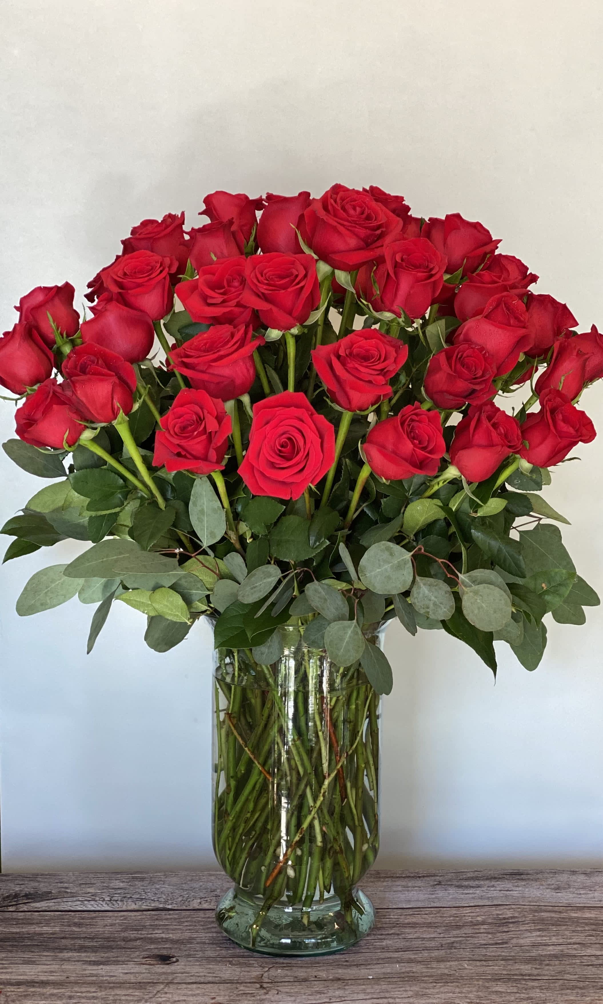 Devoted - 4 dozen roses carefully arranged to show their beauty.  A most impressive gift!