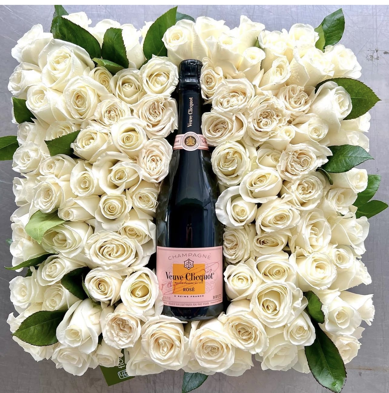Bed of Rosé and Champagne - New Years Eve - Florist in Granbury - Gorgeous bed of white roses and complimentary Veuve Clicquot Champagne… for that VERY SPECIAL Valentine.  ** pre-order 2 days in advance required!   **Color of roses can be requested