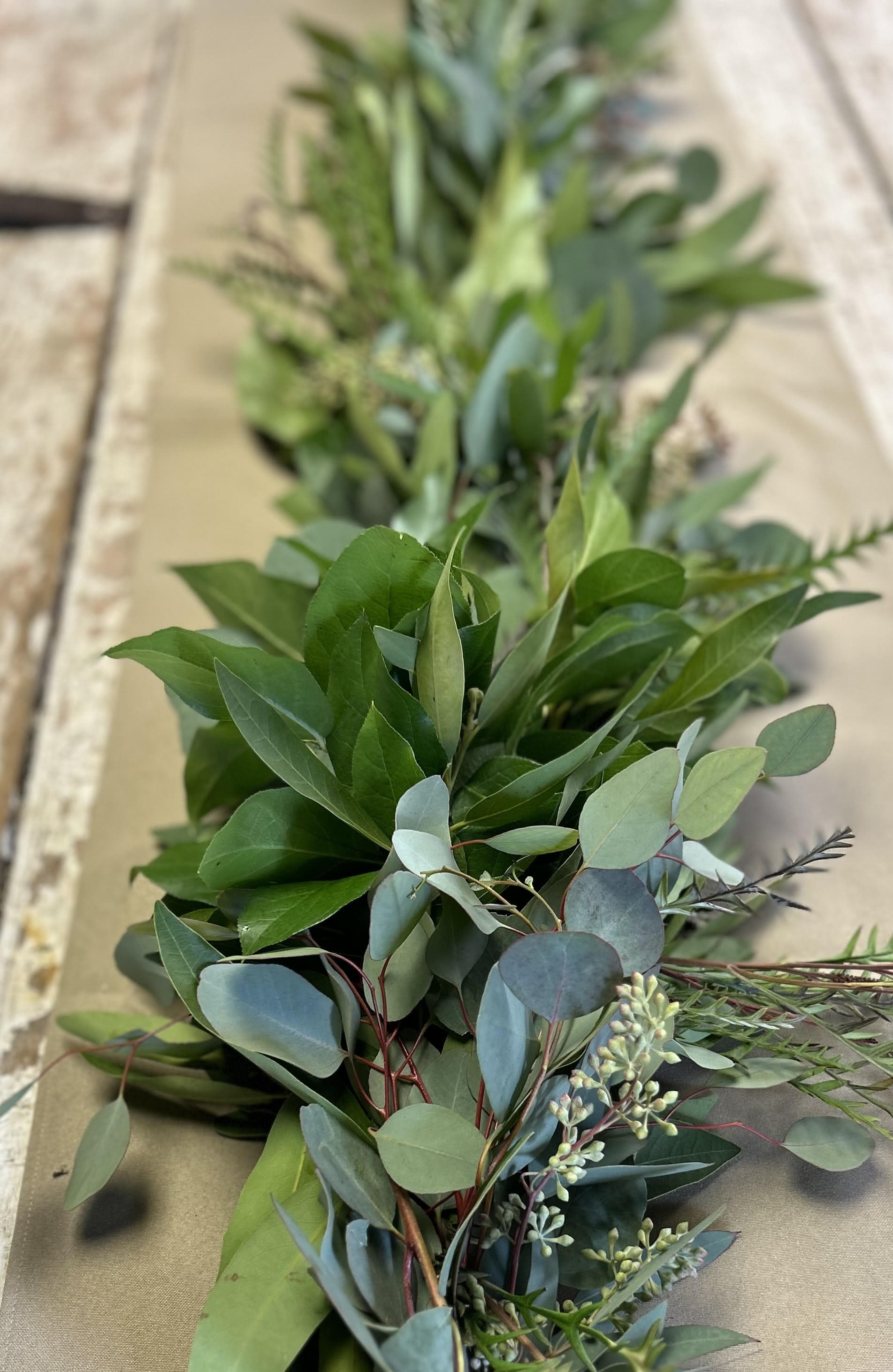 GARLAND CENTERPIECE - A 36 inch lush handmade garland of aromatic foliage that will last through the holiday season. Must have 48 hours notice. Custom options available, call the store for more information. 