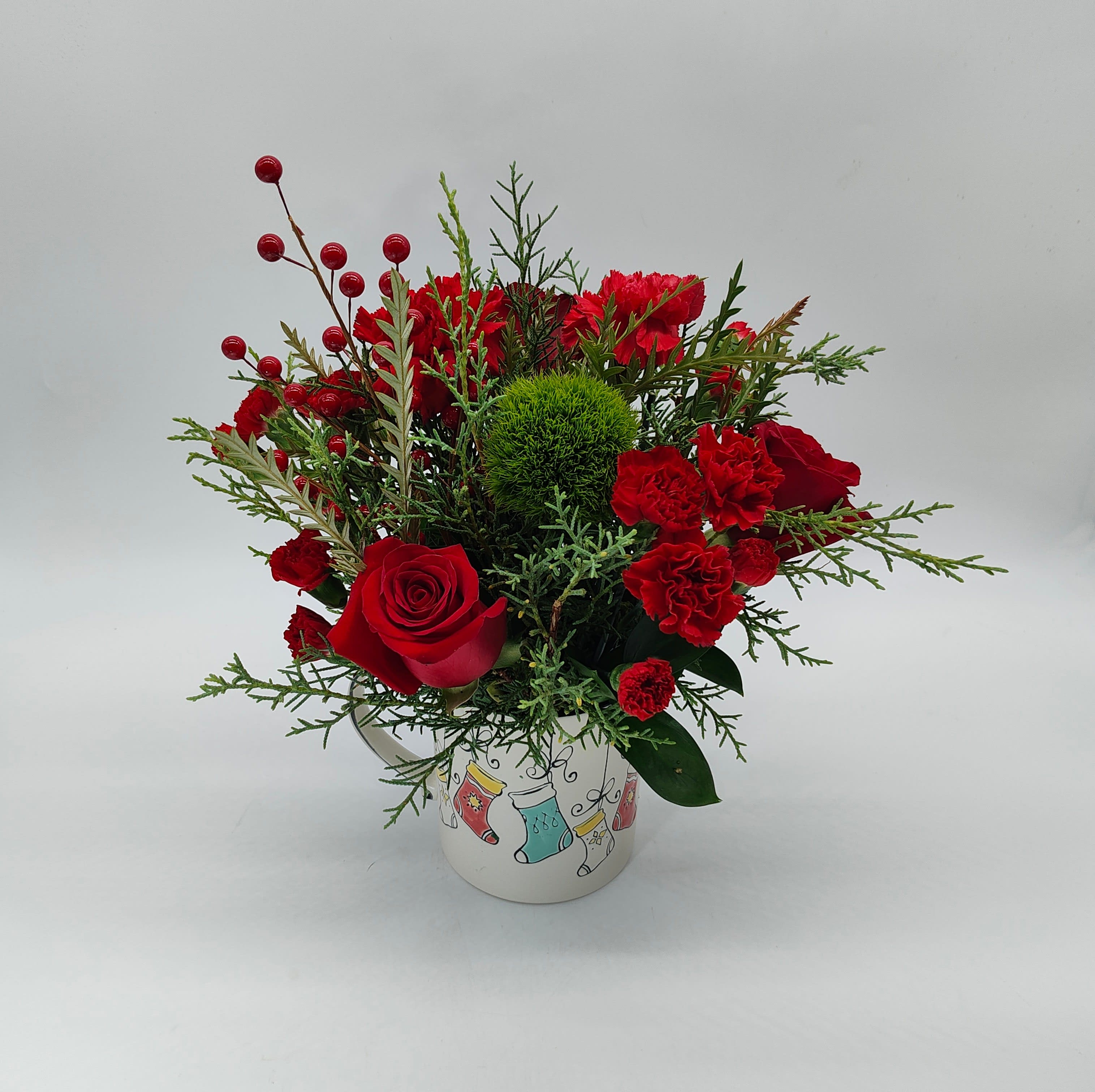 Christmas Mug - Christmas Mug filled with fragrant greens and Christmas flowers. Long lasting design. Mug design may vary