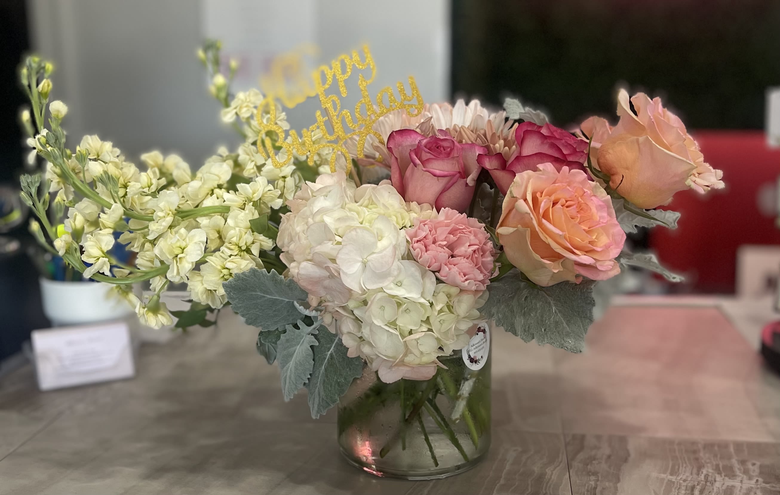 My Sunshine - This cylinder vase is filled with beautiful flowers will surely spread joy to those you’re thinking of.  filled with hydrangeas, stock, roses and carnations.  *No Happy Birthday pick included*