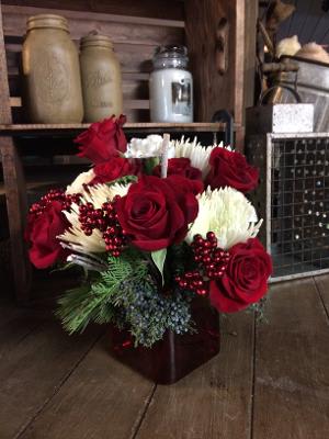 I believe  - This beautiful arrangement is filled with all the best red and white flowers the season has to offer. Holiday greens and berries.  