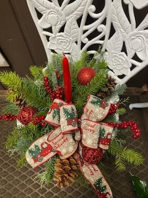 Merry Memories  - This centerpiece has beautiful Christmas greens, berries, and pinecones. 