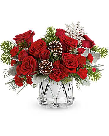 Teleflora's March Of Joy Bouquet - Teleflora's March of Joy Bouquet brings festive cheer with vibrant red blooms and frosted greenery, all arranged in Teleflora's keepsake Crystal Drum Vase. A joyful addition to any holiday celebration. Teleflora's March of Joy Bouquet features red spray roses, red carnations, and red miniature carnations. Accented with dusty miller, noble fir, white pine, and pinecones in Teleflora's Crystal Drum Vase