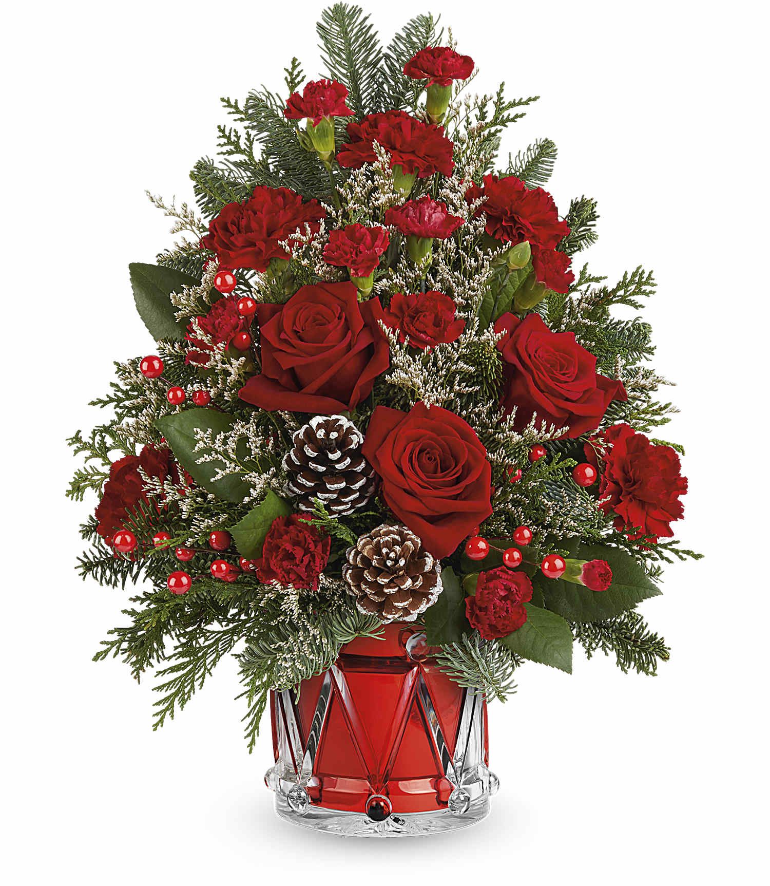 Yuletide Sparkle Tree - Teleflora's Yuletide Sparkle Tree is a festive floral Christmas tree made of red blooms, holiday greens, and shimmering accents. Arranged in Teleflora's keepsake Crystal Drum Vase, it's a joyful holiday gift or centerpiece.