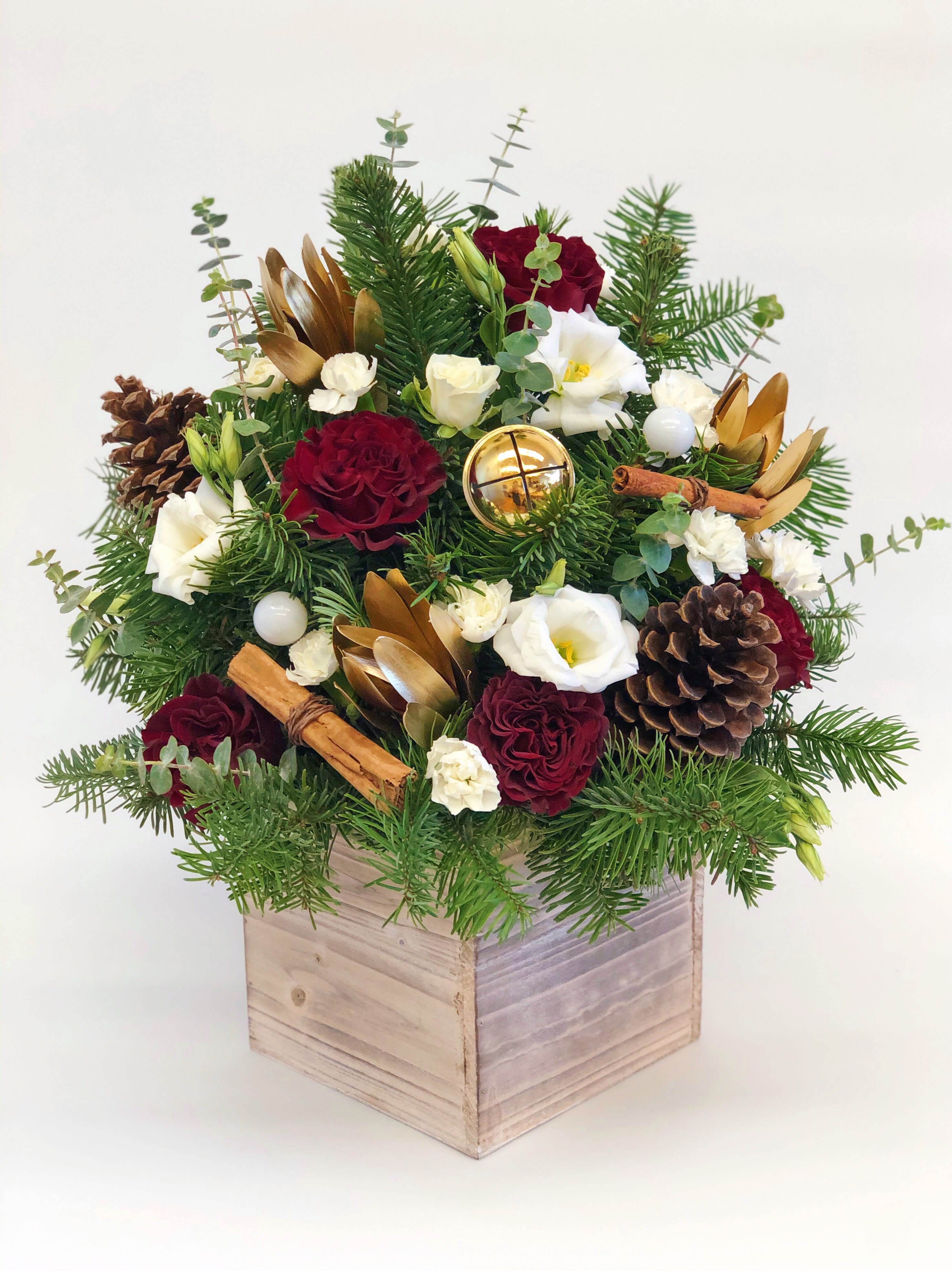 Red and Gold winter arrangement in a wood box tall - If You want bouquet with a twist, choose our flower boxes. We have wood boxes for rustic looking arrangements, or hat boxes for a more elegant look. It’s a beautiful and convenient way. Flowers in boxes don’t need vases. That makes it perfect for transportation and keeping flowers hydrated and secure. Tall wood box 18&quot;x12&quot;