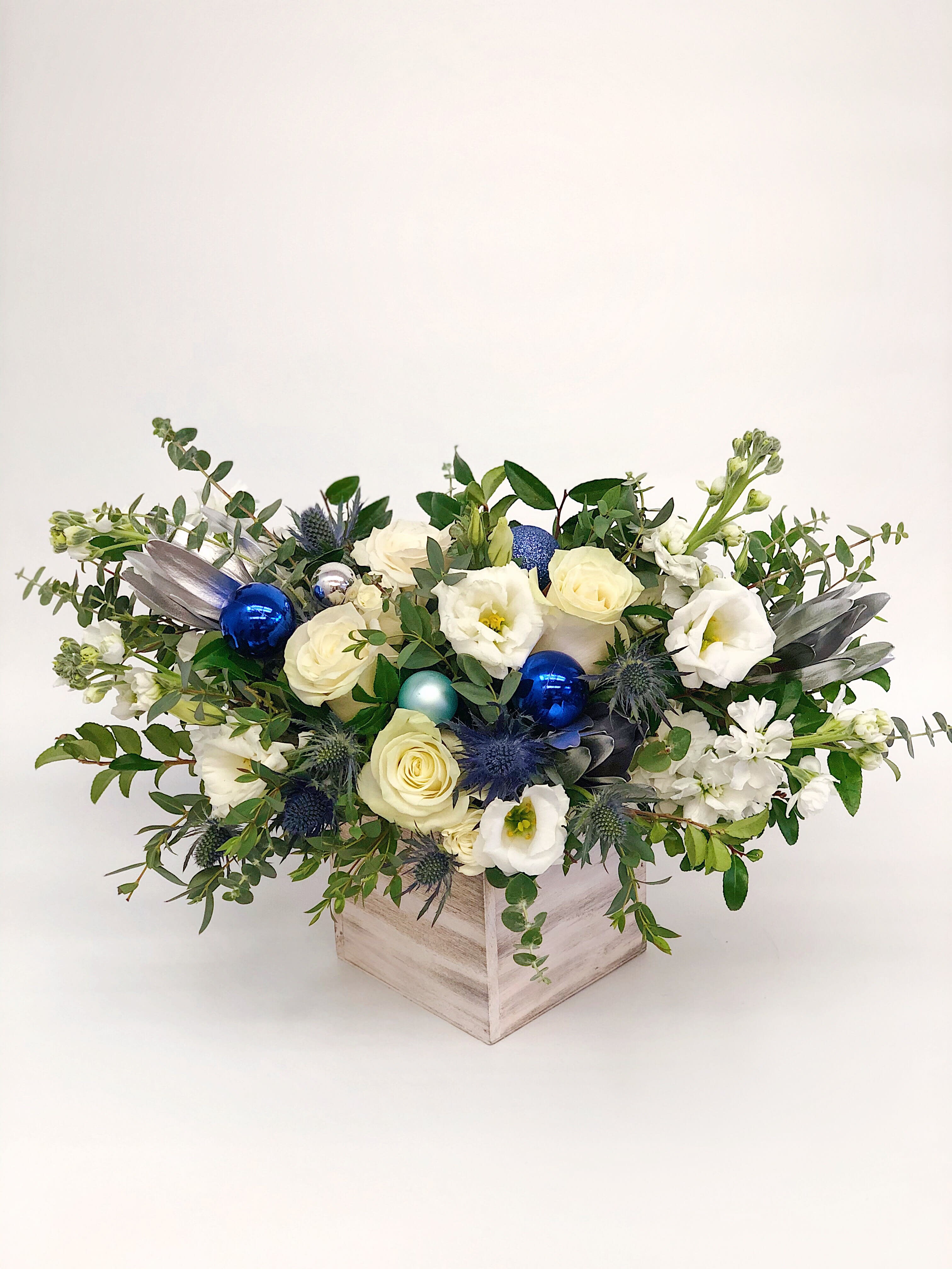 Hanukkah Garden Style Arrangement - If You want bouquet with a twist, choose our flower boxes. We have wood boxes for rustic looking arrangements, or hat boxes for a more elegant look. It’s a beautiful and convenient way. Flowers in boxes don’t need vases. That makes it perfect for transportation and keeping flowers hydrated and secure.