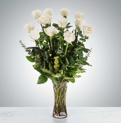 Dozen Long Stemmed White Roses by BloomNation™ - A dozen white roses are a classic gift! Perfect for Valentine's Day, an Anniversary, or any type of celebration.  Approximate Dimensions: 20"D x 30"H
